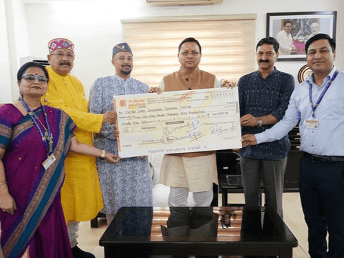 A cheque of ₹3,67,995 was handed over to Shri Badrinath Kedarnath Temple Committee