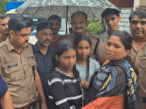 Doon Police rescued two girls who were swept away in a rain drain
