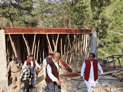 Cabinet Minister Dr Rawat inspected the cluster school under construction in Pabau