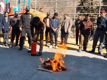 Information on fire safety given to students by Fire Service Jyotirmath