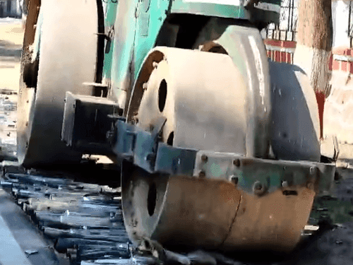 Image for Doon Police destroyed 180 modified silencers with a road roller