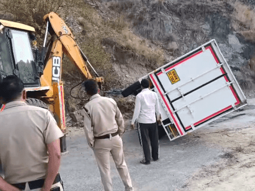 Image for Vehicle overturned on the road, rescued by District Almora Police