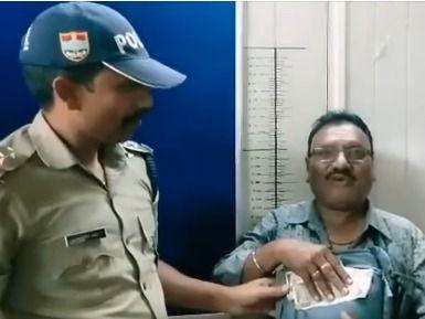 The lost bag and money were handed over by the police to its owner