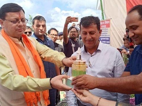Ghee and eye drops made from the milk of Badri cow were presented to CM Dhami.