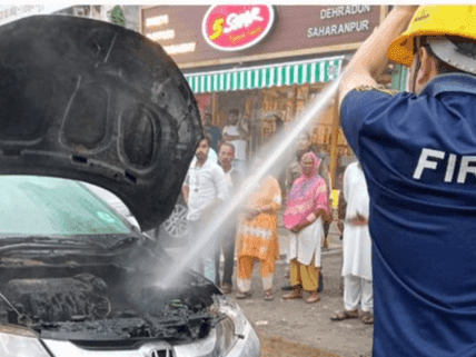 Car caught fire, police took quick action and brought the fire under control