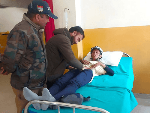 First aid given to a devotee who fainted during the journey