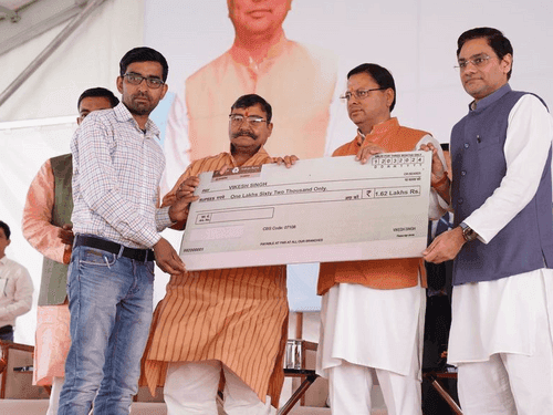 Checks distributed to beneficiaries under State Livestock Mission Scheme