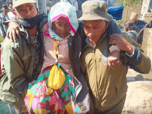First aid given to an old woman who was injured after falling from a horse
